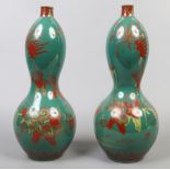 A pair of Chinese double gourd vases painted with figures.Condition report intended as a guide