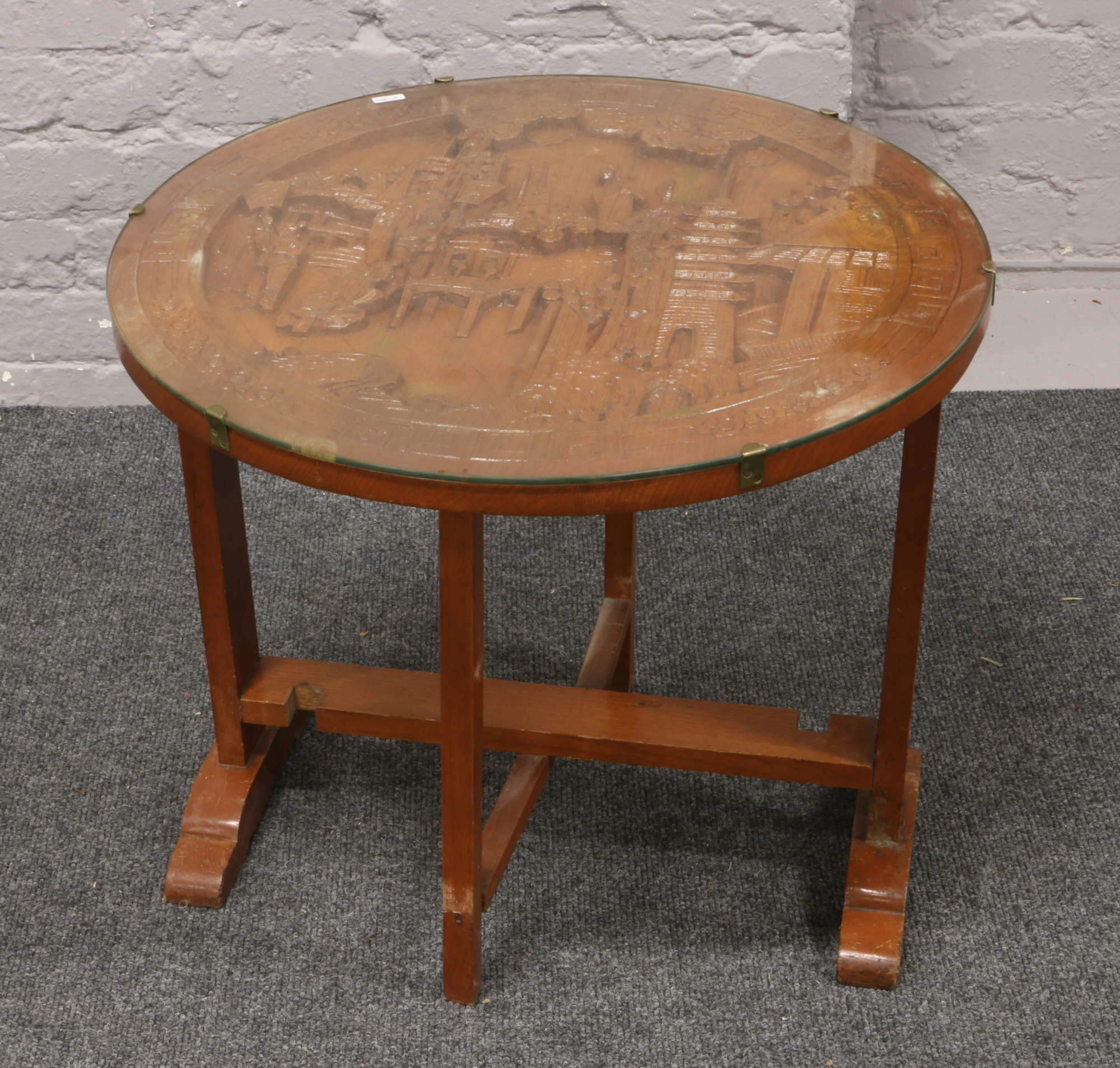 An oriental carved tilt top occasional table with glass top raised on gate leg supports. - Image 2 of 2