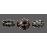 A 9ct gold and onyx claddagh ring, along with a 9ct gold and marcasite ring and a silver marcasite