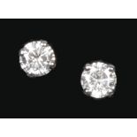 A pair of hallmarked 18ct white gold diamond stud earrings, total diamond weight approximately 1.0