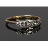 An 18ct gold three stone diamond ring set with old mine cut stones, size O1/2.