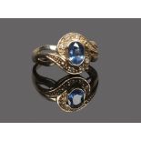 A 9ct gold sapphire and diamond dress ring with openwork shoulders.