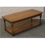 An Ercol Golden Dawn two tier coffee table.