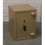 A steel safe with key, 63.5 x 46 x 44.5cm.
