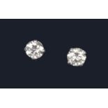 A pair of 18ct white gold diamond stud earrings, total diamond weight 0.54 carat.