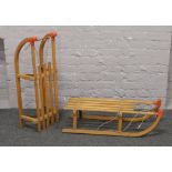A pair of Gluco wooden framed Lilo Taboggains with metal runners made in West Germany.