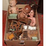 Three vintage dolls with jointed limbs, along with a quantity of dolls house furniture.