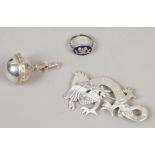 A planished silver brooch formed as a dragon, Birmingham 1953, a silver coronation orb set with a