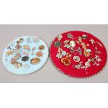 Two circular displays of costume jewellery mainly brooches to include white paste, hardstone,