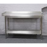 A stainless steel two tier food preparation / work station 145 x 60 x 94cm
