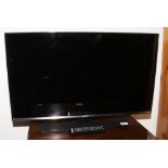 A Samsung flat screen 32 inch television model number LT32E310EX / XU remote and power cable.