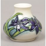 A Moorcroft miniature squat vase decorated in the Ostara pattern, first quality 5.5cm.