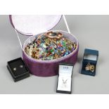 A jewellery box and contents of costume jewellery to include beads, earrings, yellow metal rings,