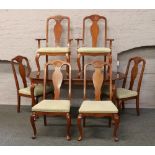 A Queen Ann style mahogany extending dining table along with a set of six matching chairs
