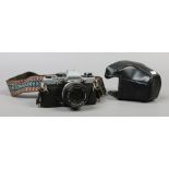An Olympus OM10 SLR 35mm camera with Olympus OM - System Zuiko MC Auto - S 1:1.8 F= 50mm lens.