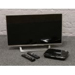 A 32inch flatscreen Sony Bravia smart TV, along with a Humax freesat recorder with remotes.