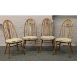 A set of four Ercol Golden Dawn Quaker swan back dining chairs.Condition report intended as a