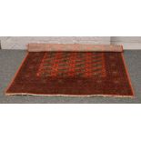 A red ground Bokhara rug 196 x140cm.