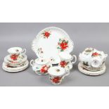 A Royal Albert bone china six part tea set decorated in the Poinsettia pattern.
