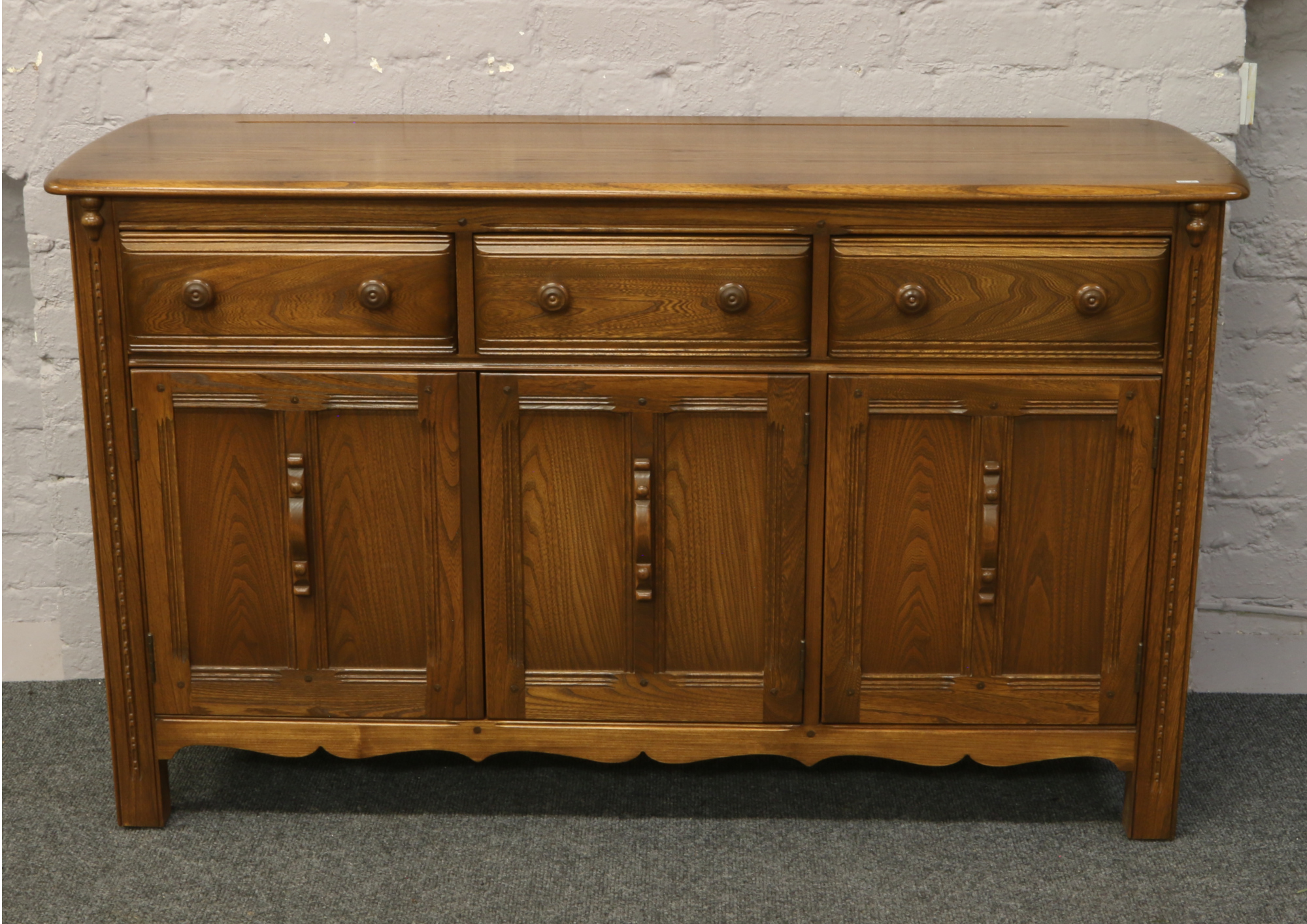 An Ercol Golden Dawn sideboard.