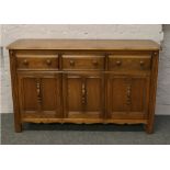 An Ercol Golden Dawn sideboard.