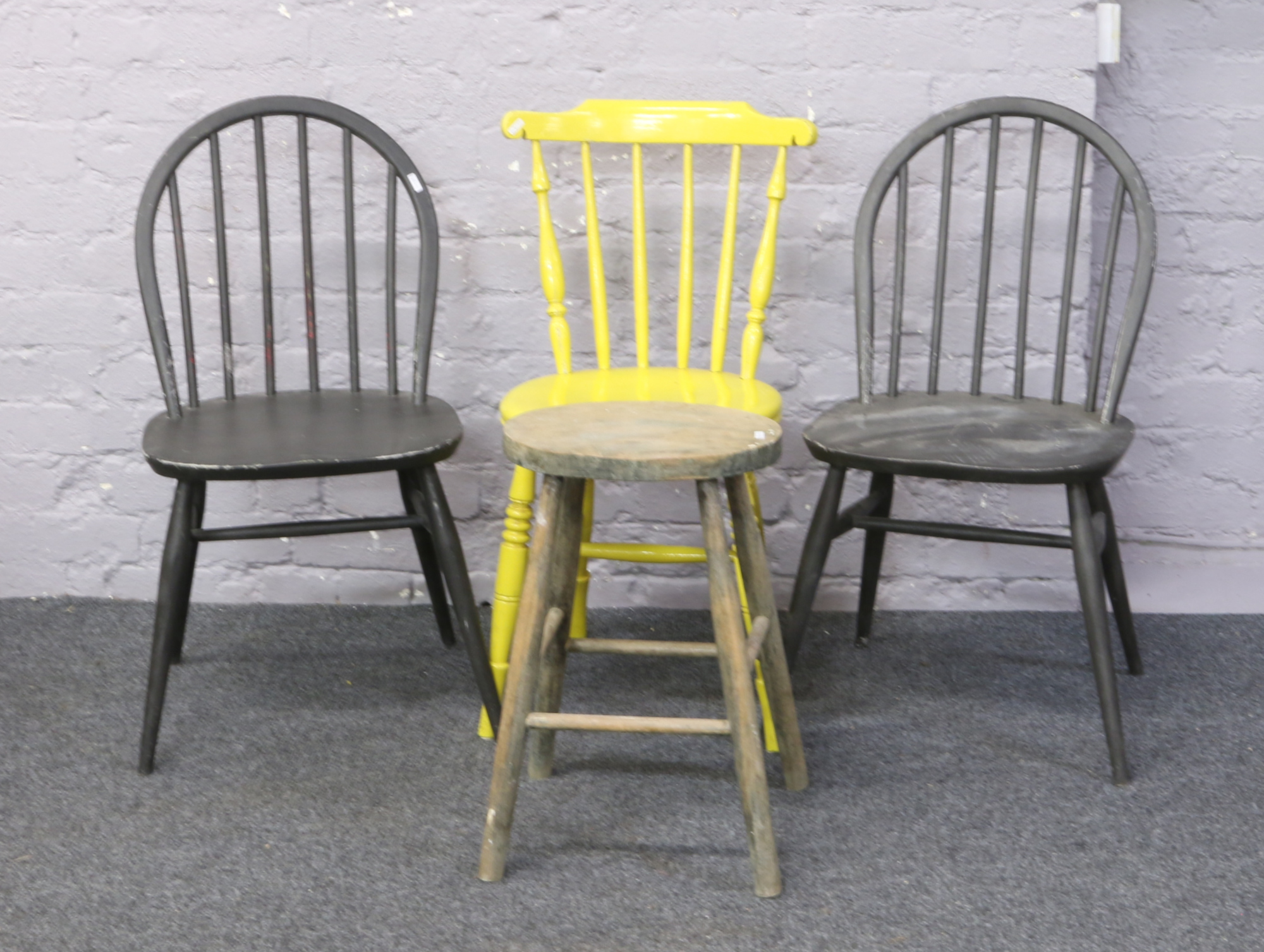 Three painted kitchen chairs and a stool.