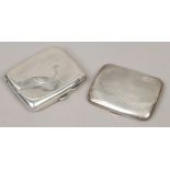 Two engraved silver cigarette cases, assayed Birmingham 1915 and 1923, 156 grams.