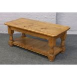 A pine two tier coffee table.