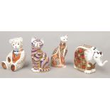 Four Royal Crown Derby bone china paperweights, two formed as cats, one of an elephant and the other