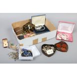 A box of costume jewellery some boxed examples, coloured paste beads and a quizzing glass etc.