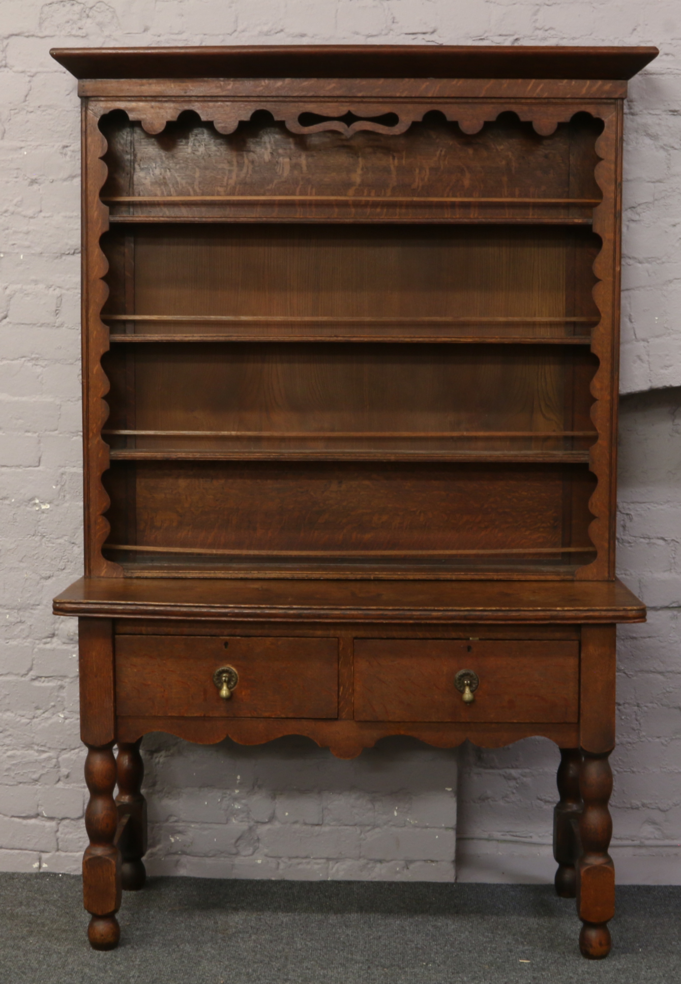 A Victorian oak dresser raised over turned supports, 198.5cm x 135cm.