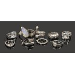 Ten silver dress rings to include white paste examples.