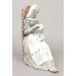 A large Lladro figure of a seated maiden embroidering, approximate height 28cm Condition report