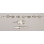 Three pieces of Iona silver jewellery; a Celtic style bracelet with John Hart monogram, bar brooch