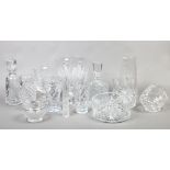A large quantity of cut glassware to include vases, decanters, Stuart crystal etc.