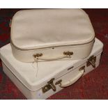 A vintage cream antler suitcase and another example.