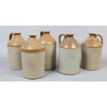 A collection of five stoneware flagons.