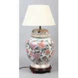 A large baluster shape vase with floral decoration formed as a table lamp, height 60cm with shade.