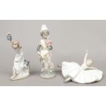 A Lladro figure of a girl, along with two Nao figures one of a young ballerina the other a girl