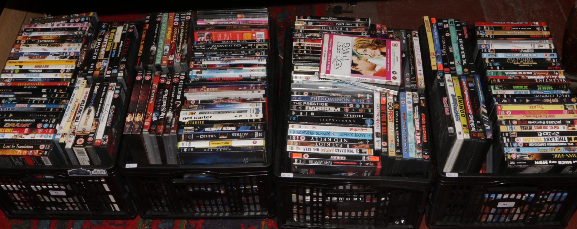 Four boxes of DVDs to include action, comedy, Romance etc.