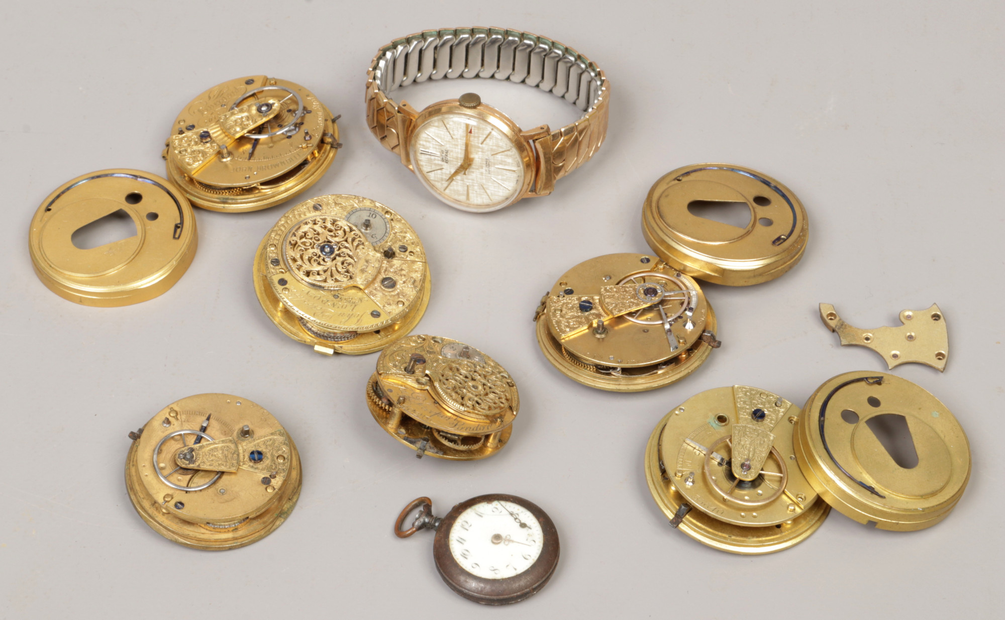 A box of mainly pocket watch movements including two fusee watches with verge escapements, Smiths