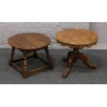 A circular oak occasional table, along with a similar walnut example.
