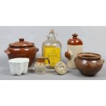 A collection of kitchenalia to include stoneware, jelly mould, short bread mould, glass demijohn.