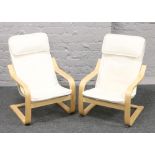 A pair of Ikea child's easy chairs.