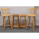 Two pine stools along with two breakfast bar chairs.