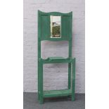 A painted green wooden hall stand with bevel edge mirror back 183cm x 72cm x 29cm.