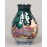 A Moorcroft baluster vase by Sally Tuffin decorated in the Mamoura pattern, 13cm.