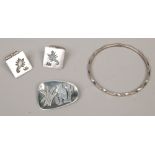 Three pairs of Mexican silver jewellery including a bangle, brooch and a pair of Scorpion cufflinks.