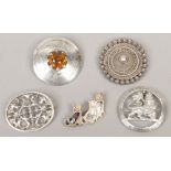 Five white metal brooches including a Scottish example set with a citrine effect stone.