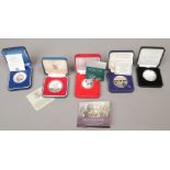 Five cased commemorative collectors coins, four silver including The battle of Trafalgar five pound,